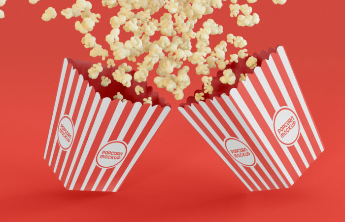 two popcorn boxes in a red background