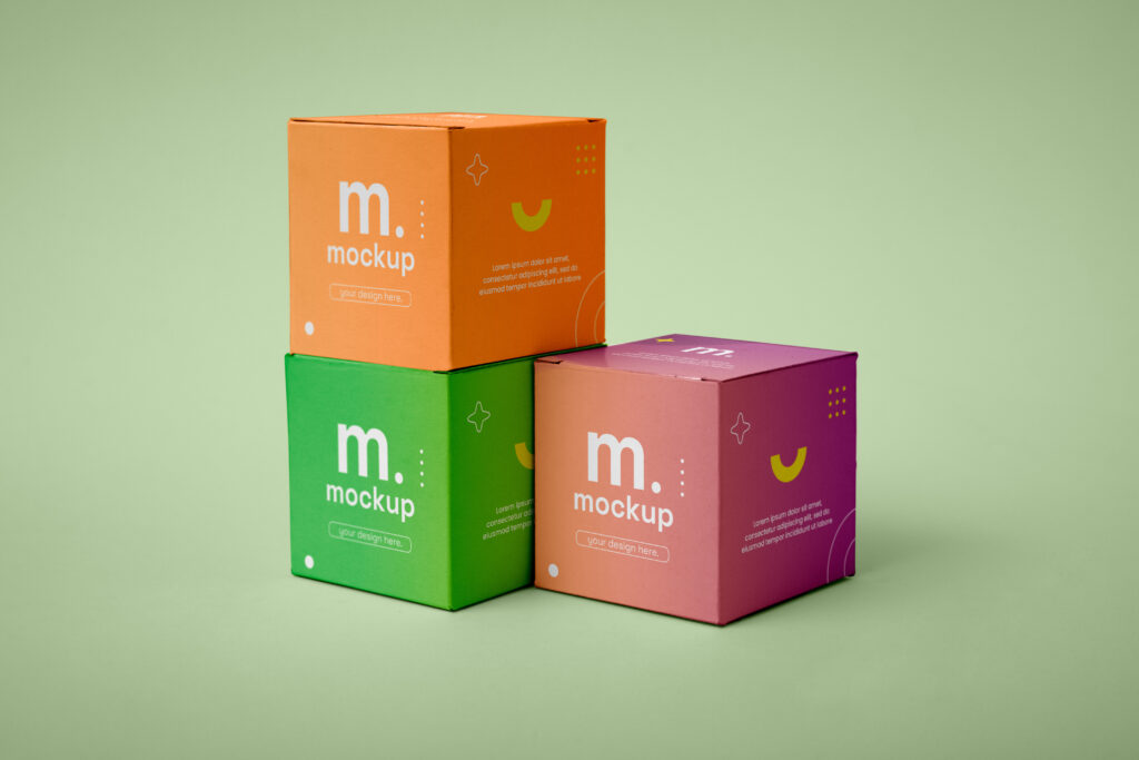 colorful 3 custom cube boxes on a green background