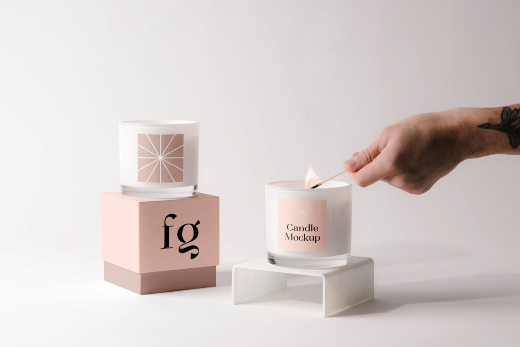 Custom candle box and a candle placed on a white surface.