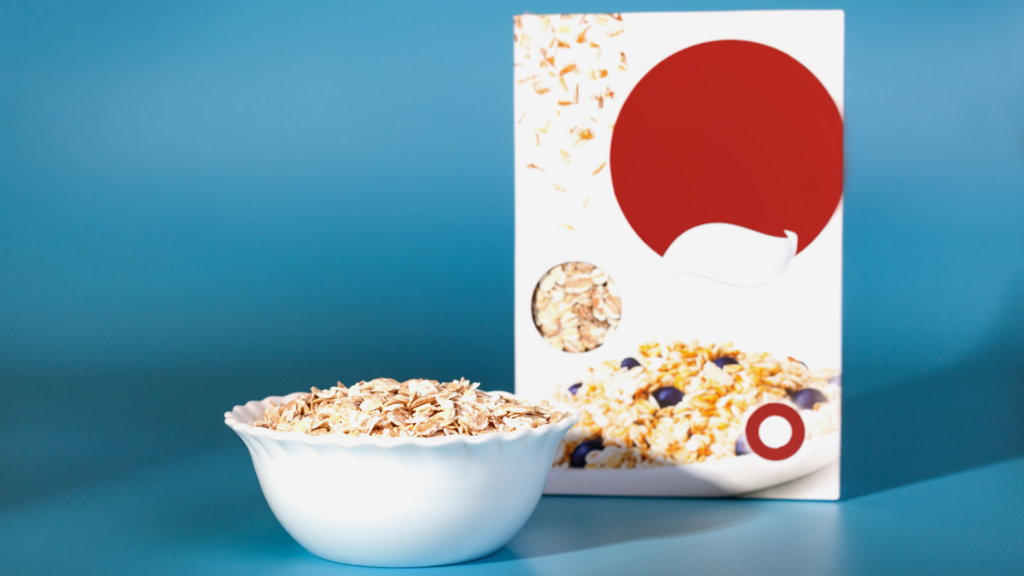 bowl of cereal and a custom cereal box in a blue background