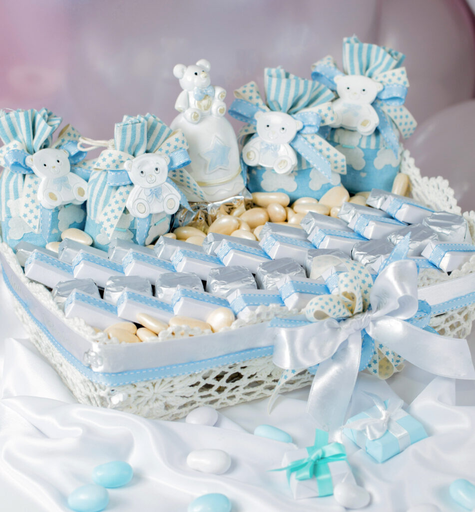 candy bar with blue chocolate filled custom favor boxes for a baby shower