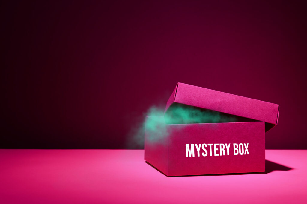 Halfly opened Pink color core custom mystery box on a pink color surface.
