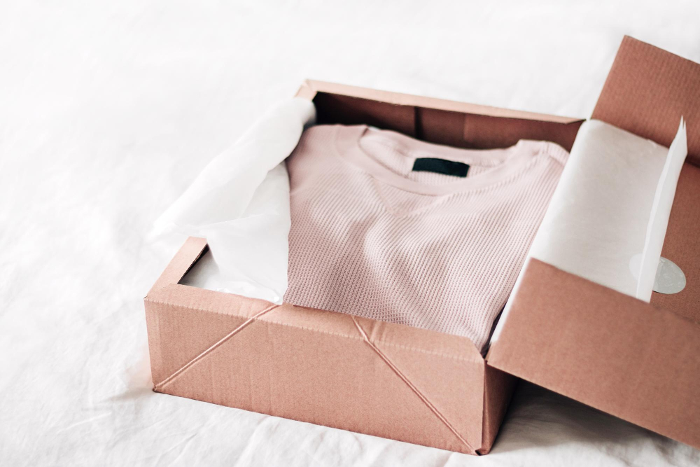 an image of a apparel box packaging with clothes inside