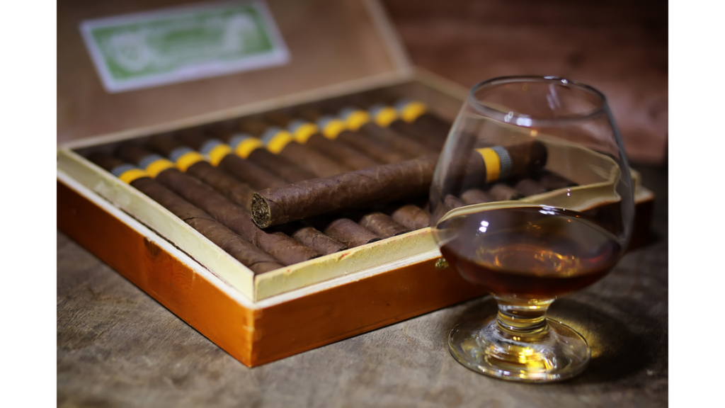 Custom cigar box and a vine glass in front of it.