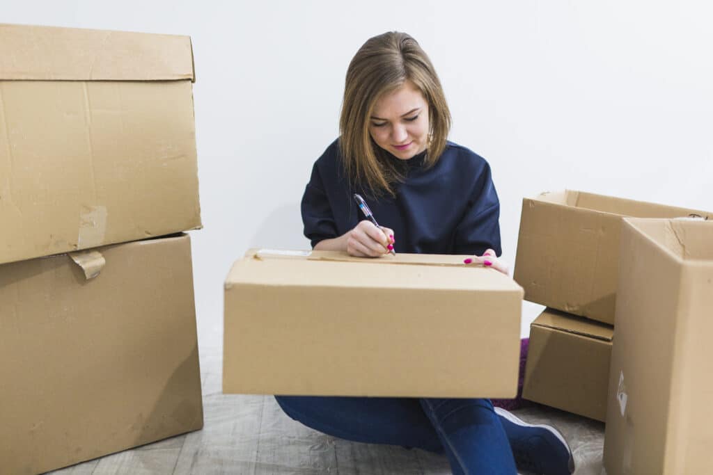 a women measuring dimensions of a box