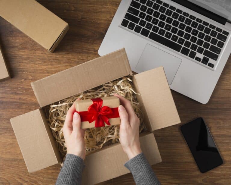 Person preparing Subscription Box Packaging